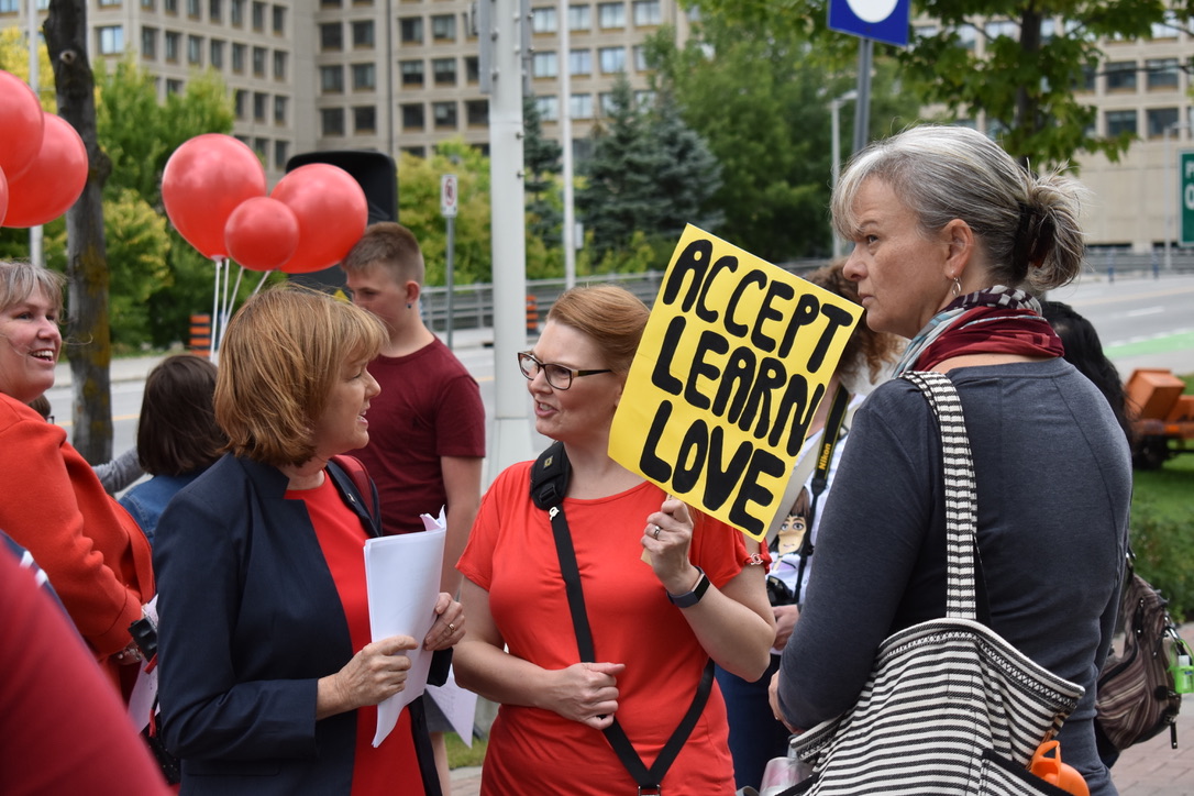 FASD Walk Participants with Accept, Learn Love Placard